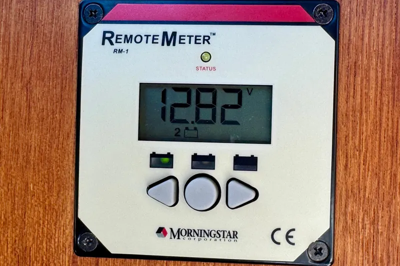 Slide: The Image of Remote meter display showing 12.82 volts on a Ranger 27, 2012 model. - 61