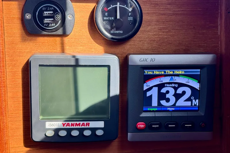 Slide: The Image of Control panel of a 2012 Ranger 27 boat with navigation instruments. - 62
