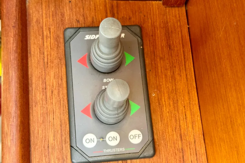 Slide: The Image of Control panel for thrusters on 2012 Ranger 27 boat, featuring dual joysticks. - 63