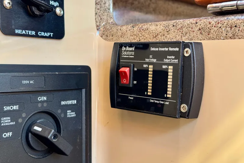 Slide: The Image of Control panel of a 2012 Ranger 27 boat with inverter and power settings. - 65