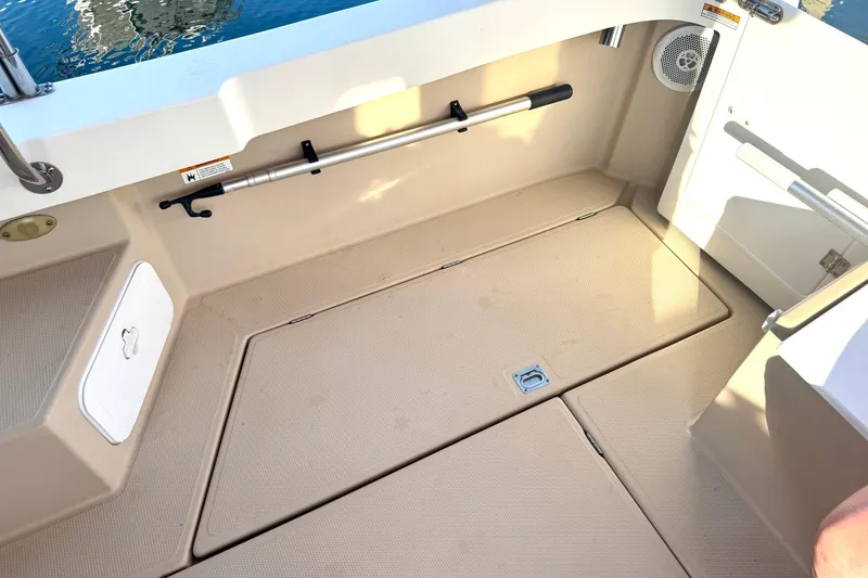 Slide: The Image of Spacious deck area of 2012 Ranger 27 boat with storage compartments. - 69