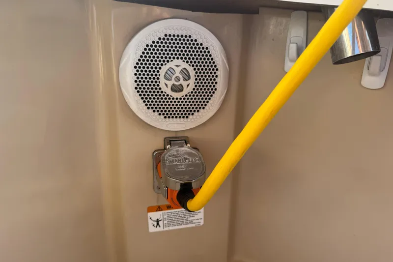 Slide: The Image of Boat electrical outlet with yellow cable and speaker, Ranger 27 model, 2012. - 75