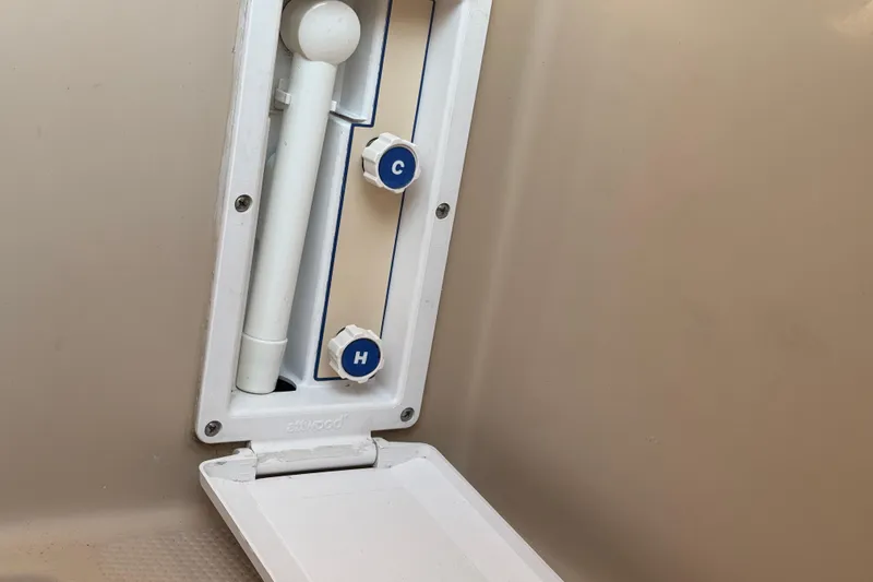Slide: The Image of Ranger 27 boat shower controls with hot and cold knobs, 2012 model. - 76