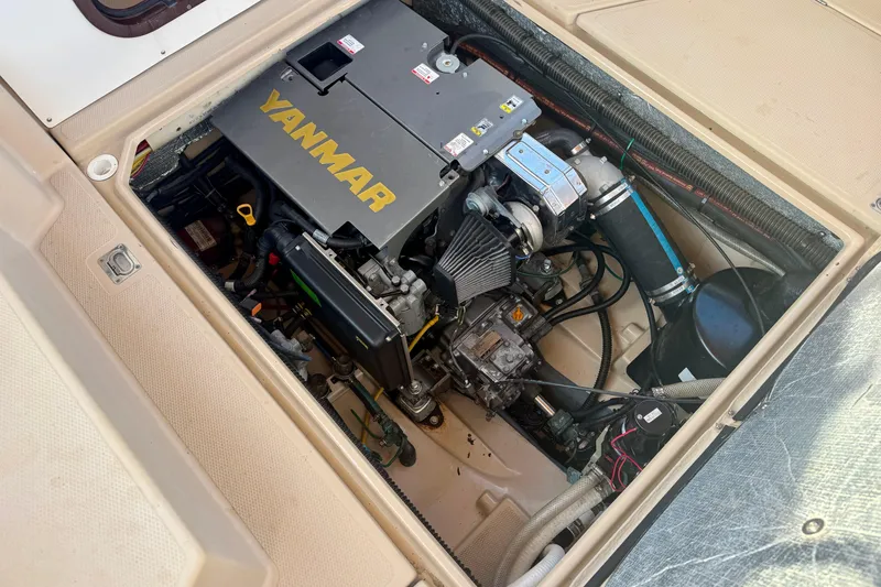 Slide: The Image of Engine compartment of a 2012 Ranger 27 boat featuring a Yanmar engine. - 81