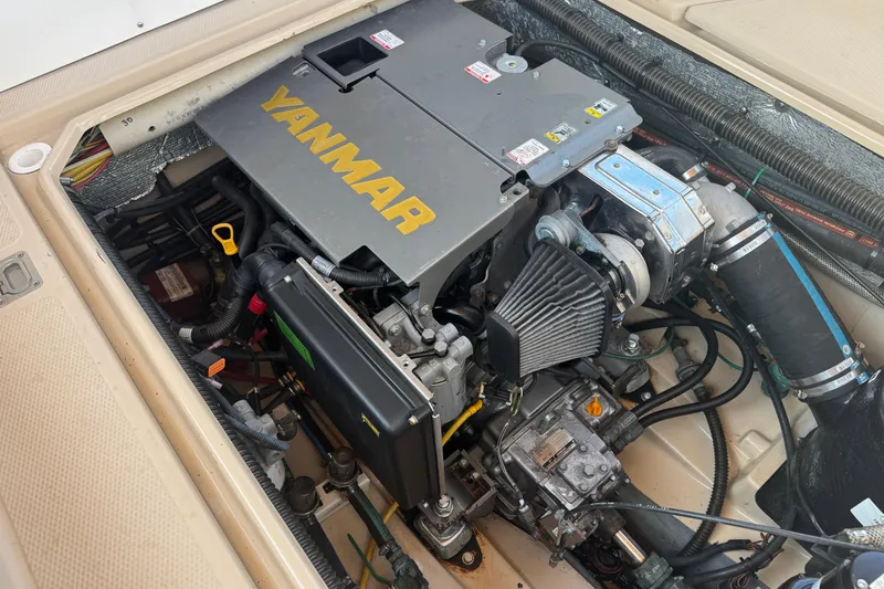 Slide: The Image of Engine compartment of a 2012 Ranger 27 boat featuring a Yanmar engine. - 82