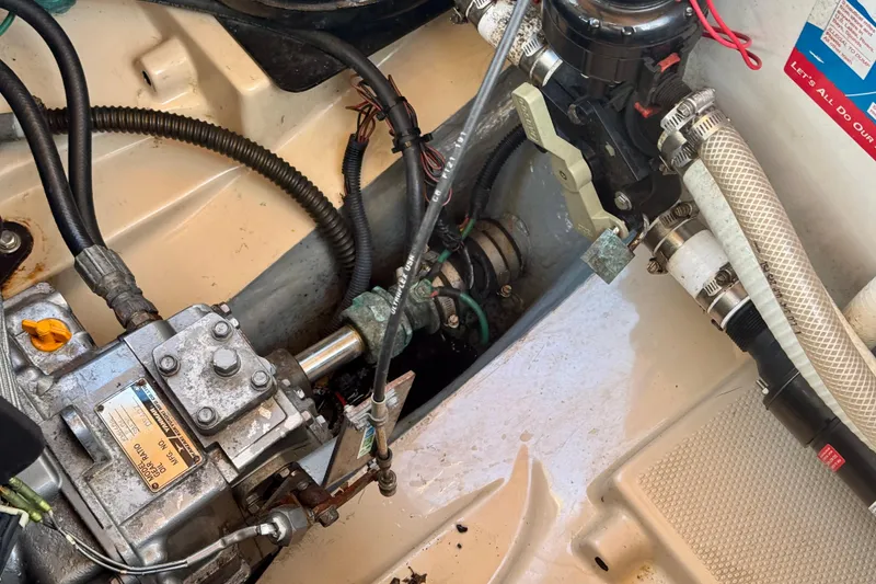 Slide: The Image of Engine compartment of a 2012 Ranger 27 boat, showing mechanical components and wiring. - 85