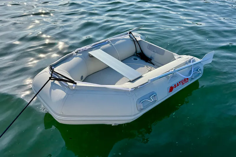 Slide: The Image of Inflatable boat on water, Ranger 27 model, 2012, with oars and bench seat. - 88