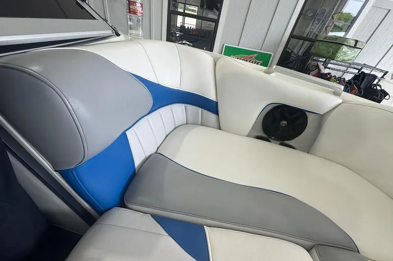 Slide: The Image of 2019 MB F22 Tomcat boat interior with white, blue, and gray seating. - 15