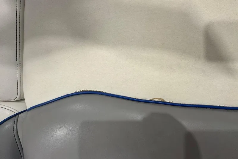 Slide: The Image of Close-up of 2019 MB F22 Tomcat seat with visible wear and blue trim. - 18