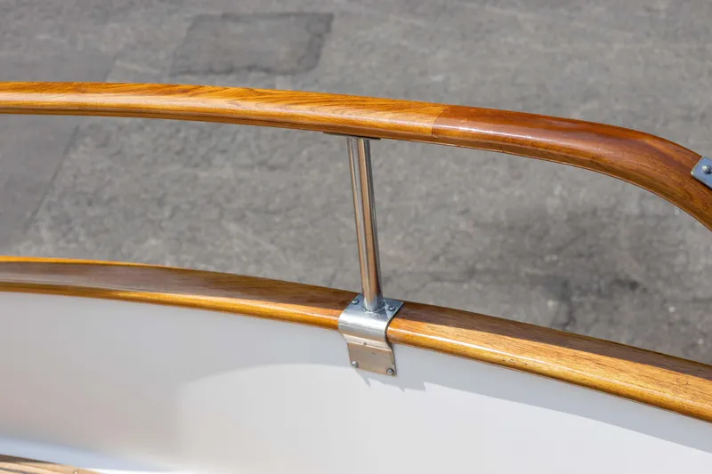 Slide: The Image of Wooden railing detail on a 1988 Grand Banks 36 Sedan boat. - 22