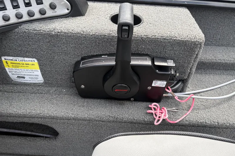 Slide: The Image of Control panel of 2015 Lund 1650 Rebel XL Sport boat with Mercury throttle. - 12