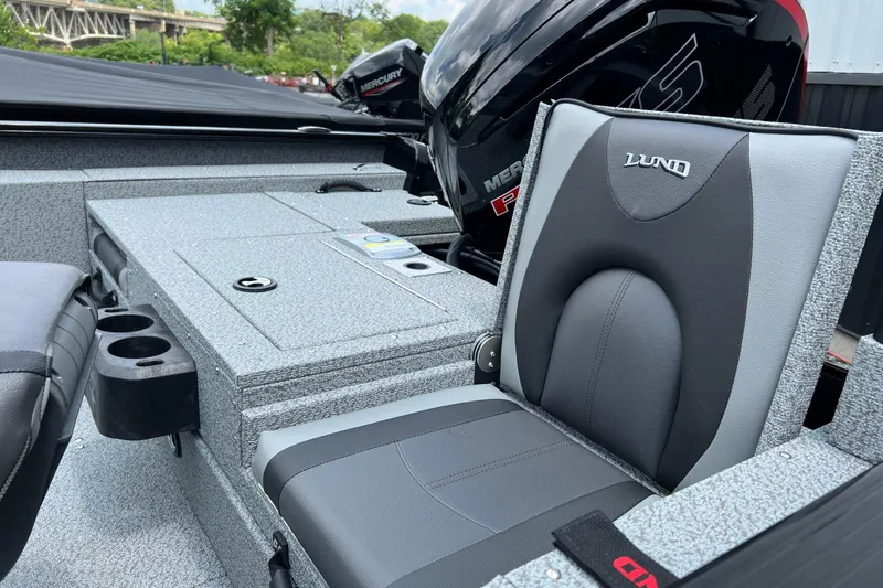 Slide: The Image of 2025 Lund 1775 Adventure Sport boat interior with Mercury engine, featuring comfortable seating and storage. - 12
