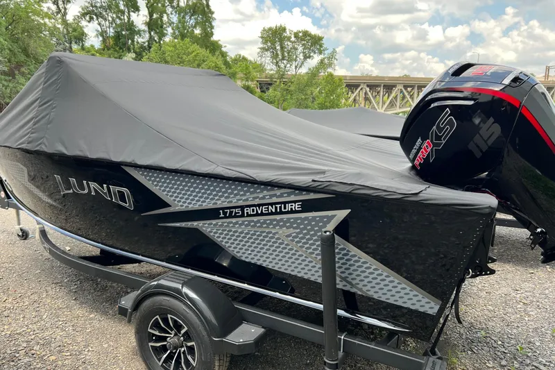 Slide: The Image of 2025 Lund 1775 Adventure Sport boat with cover and Mercury Pro XS engine. - 3