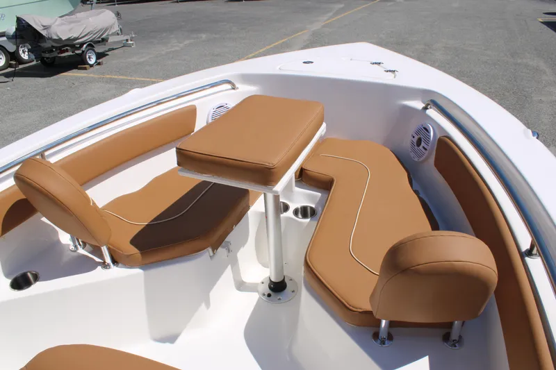 Slide: The Image of 2026 Key West 203 FS boat interior with tan seating and table. - 13