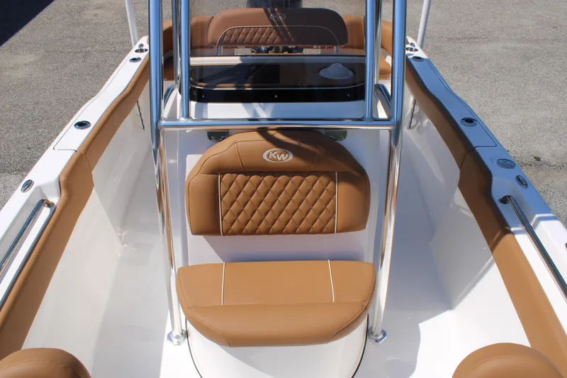 Slide: The Image of 2026 Key West 203 FS boat interior with tan seating and stainless steel frame. - 14