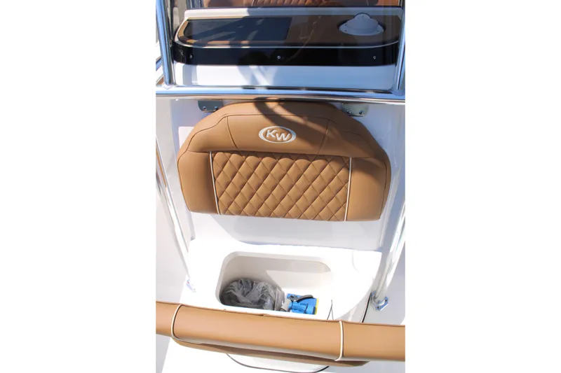 Slide: The Image of 2026 Key West 203 FS boat seat with tan quilted upholstery and storage compartment. - 15