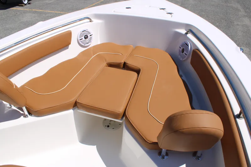 Slide: The Image of 2026 Key West 203 FS boat with tan cushioned seating and stainless steel railings. - 21