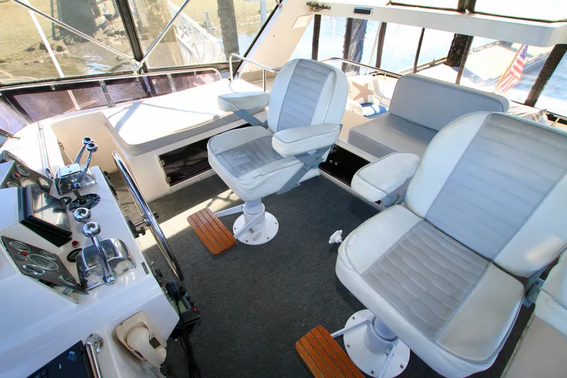 Slide: The Image of Interior of 1987 Ocean Alexander 42 yacht with helm and seating area. - 27