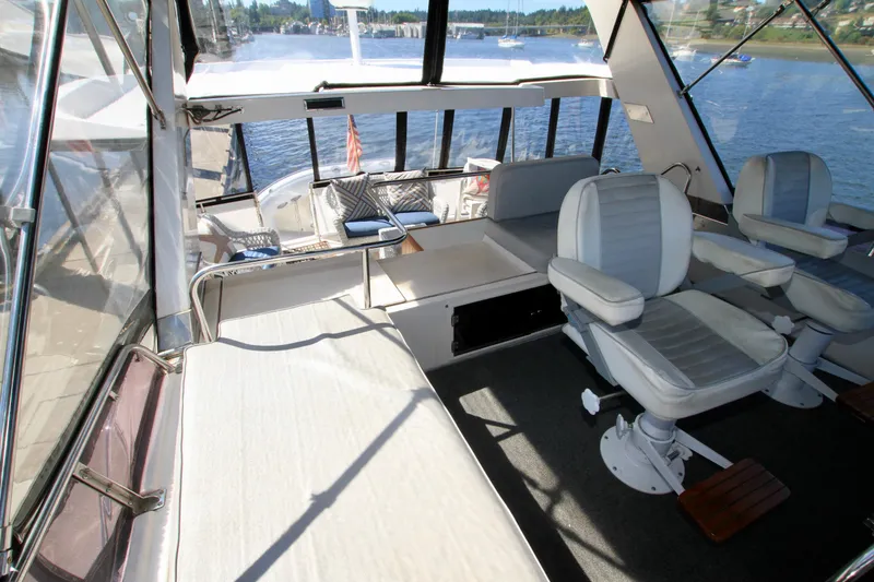 Slide: The Image of Interior view of 1987 Ocean Alexander 42 yacht with seating and water view. - 32