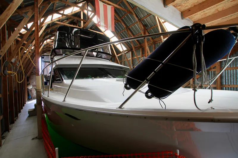 Slide: The Image of 1987 Ocean Alexander 42 yacht stored in a wooden boathouse with protective fenders. - 35