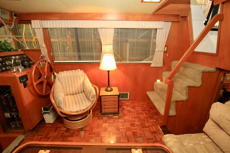 Slide: The Image of Interior of 1987 Ocean Alexander 42 yacht with wooden decor and cozy seating. - 37