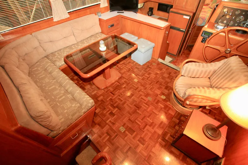 Slide: The Image of Interior of 1987 Ocean Alexander 42 yacht with cozy seating and wooden decor. - 39