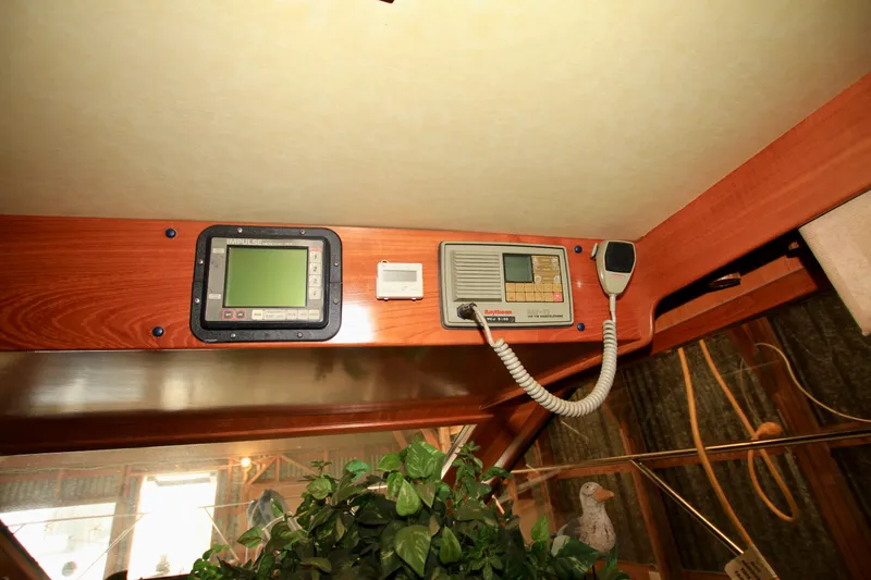 Slide: The Image of Control panel of a 1987 Ocean Alexander 42 yacht with navigation equipment. - 40