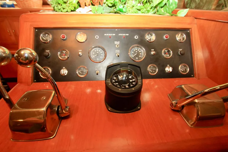 Slide: The Image of Control panel of a 1987 Ocean Alexander 42 yacht with compass and gauges. - 42