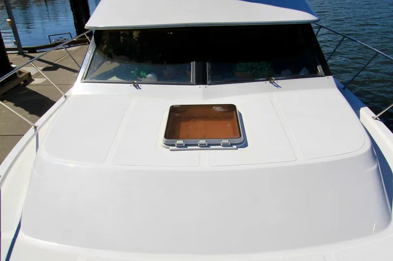 Slide: The Image of 1987 Ocean Alexander 42 yacht deck with hatch, docked by the water. - 5