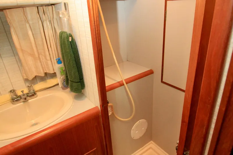 Slide: The Image of Bathroom interior of 1987 Ocean Alexander 42 yacht with sink and shower. - 51