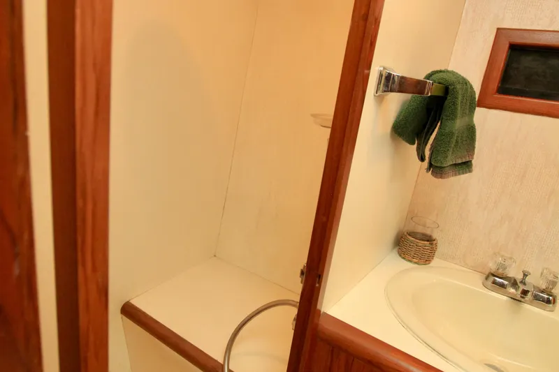 Slide: The Image of Bathroom interior of 1987 Ocean Alexander 42 yacht, featuring sink and towel rack. - 64