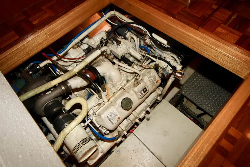 Slide: The Image of Engine compartment of a 1987 Ocean Alexander 42 yacht, showcasing intricate machinery. - 65