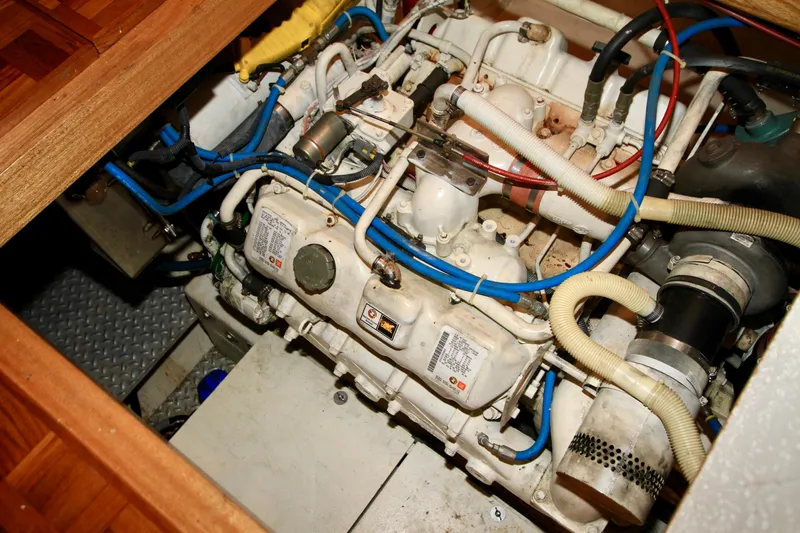 Slide: The Image of Engine compartment of a 1987 Ocean Alexander 42 yacht, showcasing detailed mechanical components. - 68