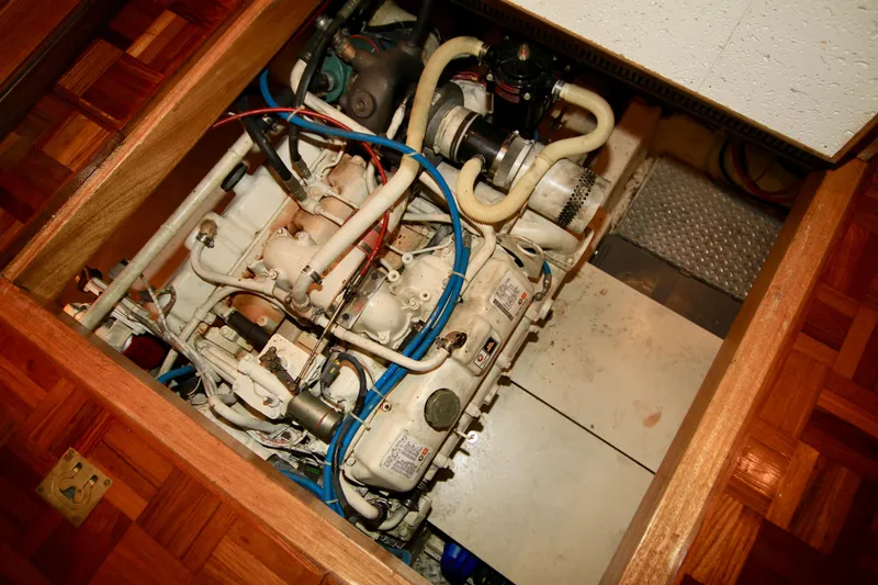 Slide: The Image of Engine compartment of 1987 Ocean Alexander 42 yacht, showcasing intricate mechanical components. - 69