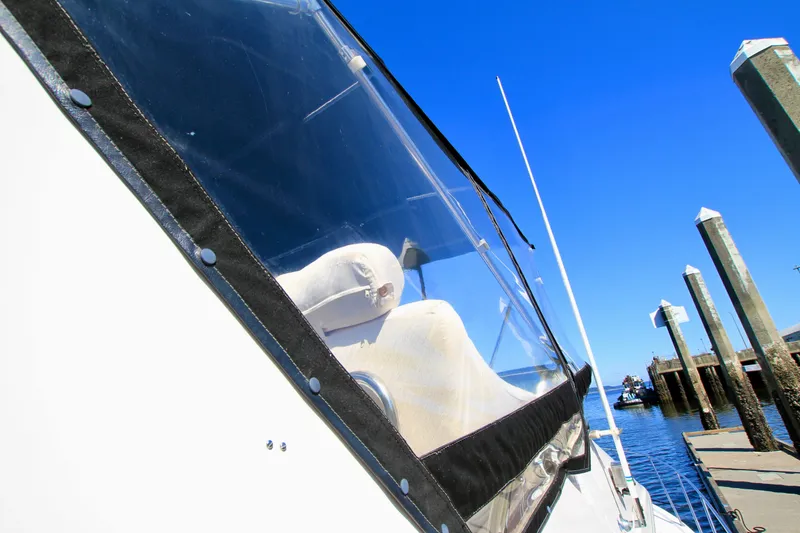 Slide: The Image of 1987 Ocean Alexander 42 yacht docked under clear blue sky. - 8