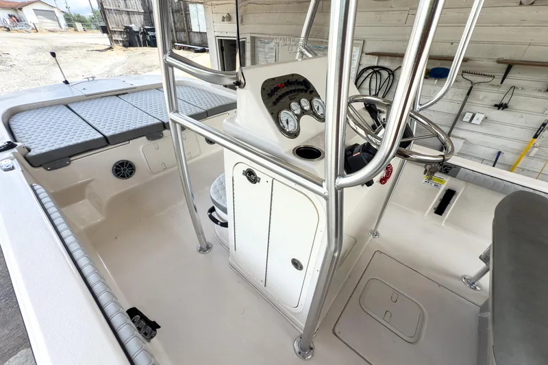 Slide: The Image of 2026 Carolina Skiff 23 LS boat interior with gray cushioned seating and sleek design. - 11