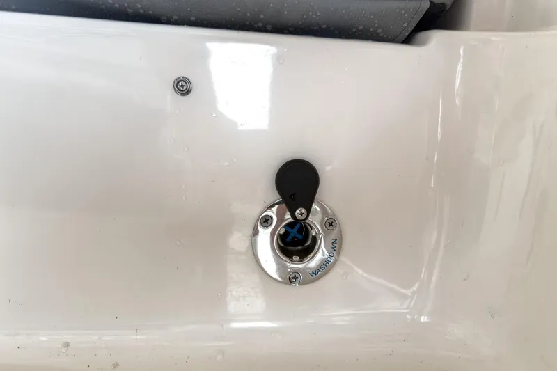 Slide: The Image of 2026 Carolina Skiff 23 LS boat interior with steering console and rod holders. - 14