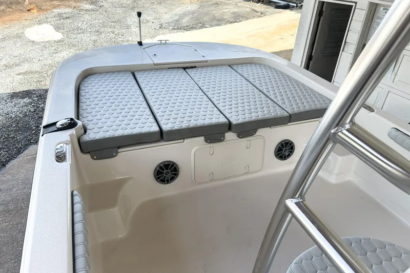 Slide: The Image of 2026 Carolina Skiff 23 LS boat interior with steering console and rod holders. - 15