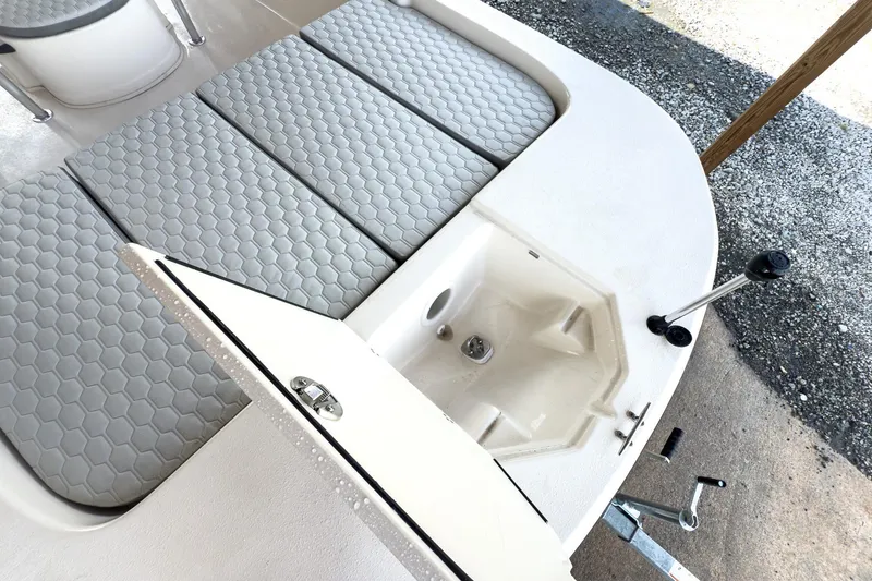 Slide: The Image of 2026 Carolina Skiff 23 LS washdown fitting on white boat surface. - 20