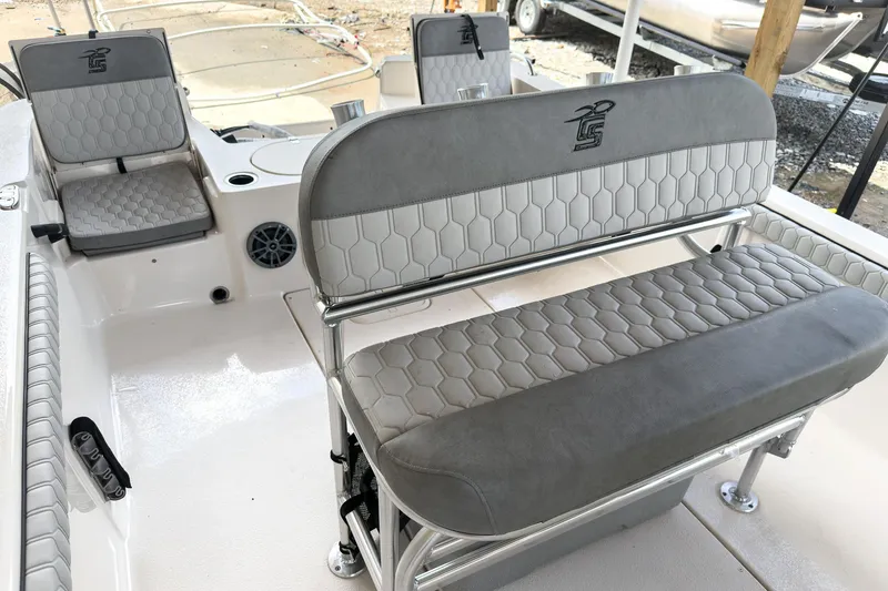 Slide: The Image of 2026 Carolina Skiff 23 LS boat displayed at an indoor boat show. - 5