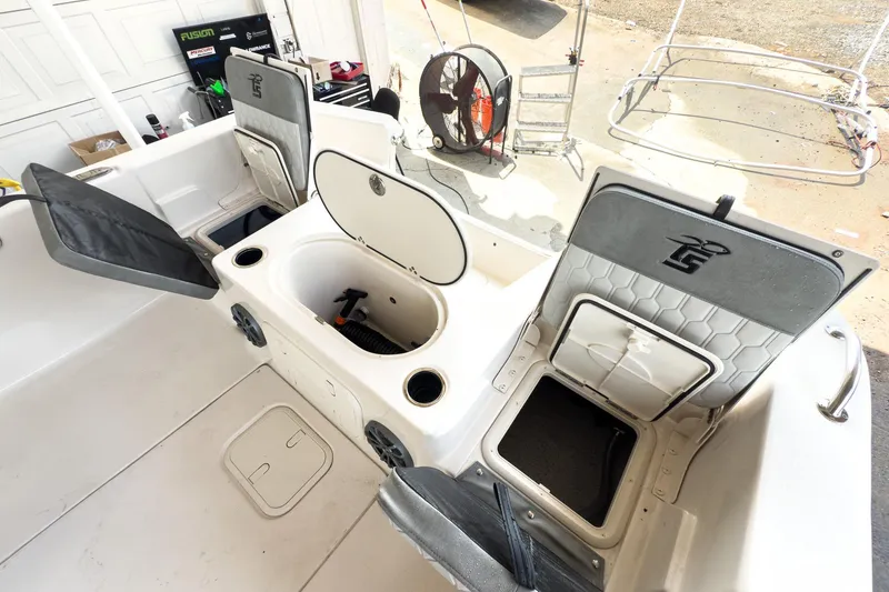 Slide: The Image of 2026 Carolina Skiff 23 LS boat displayed at an indoor exhibition, featuring sleek design and modern amenities. - 7