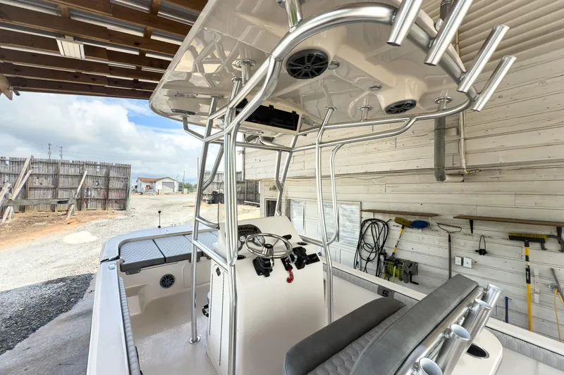 Slide: The Image of 2026 Carolina Skiff 23 LS boat on trailer in a garage setting. - 8