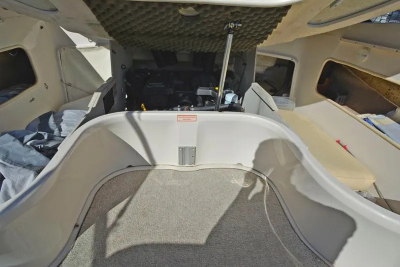 Slide: The Image of Interior of 2000 Sea Ray 260 Bow Rider boat, featuring spacious cabin layout. - 21