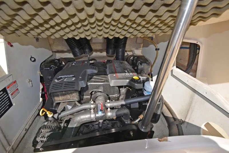 Slide: The Image of Engine compartment of a 2000 Sea Ray 260 Bow Rider boat, featuring a V8 engine. - 22