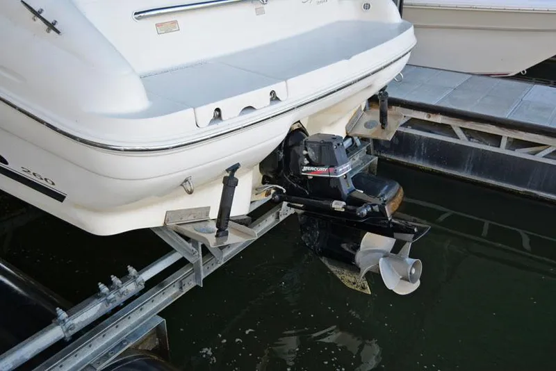 Slide: The Image of 2000 Sea Ray 260 Bow Rider boat with outboard motor at dock. - 23