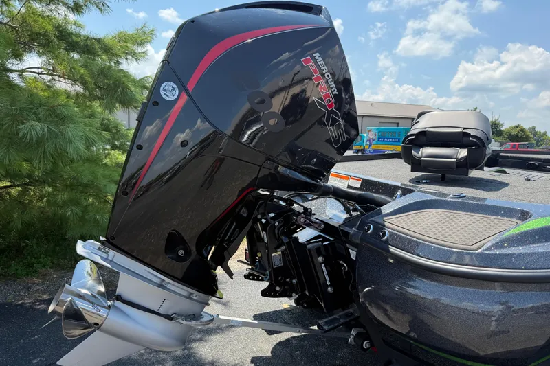 Slide: The Image of 2023 Nitro Z19 boat with Mercury Pro XS engine, parked outdoors under a clear sky. - 12