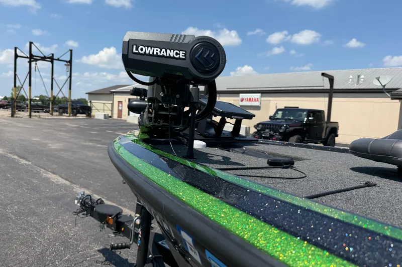 Slide: The Image of 2023 Nitro Z19 boat with Lowrance equipment, parked outdoors under a clear sky. - 17