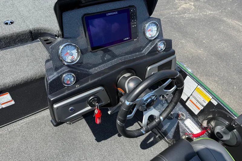 Slide: The Image of 2023 Nitro Z19 boat dashboard with steering wheel and digital display. - 20