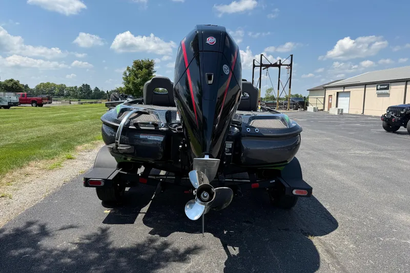 Slide: The Image of 2023 Nitro Z19 boat on trailer, parked outdoors under a clear blue sky. - 4