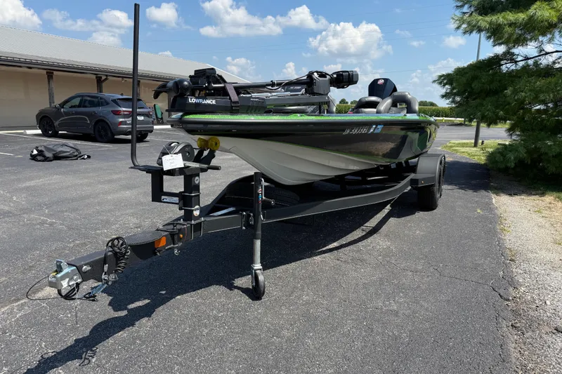 Slide: The Image of 2023 Nitro Z19 boat on trailer in parking lot, sunny day, blue sky. - 7